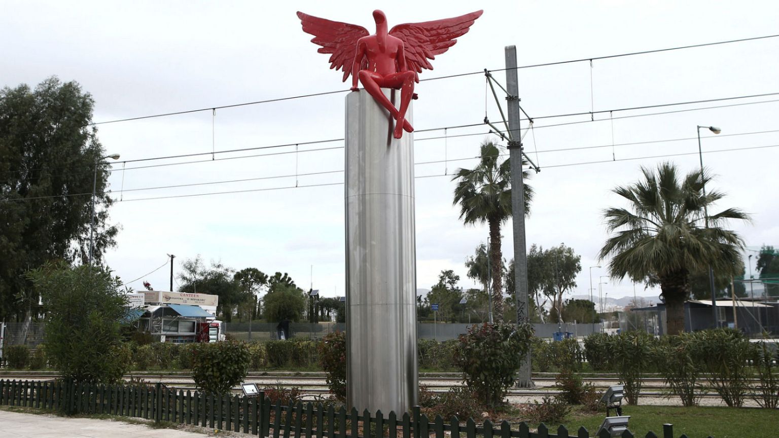 Protesters tear down red-winged 'Satan' statue in Athens