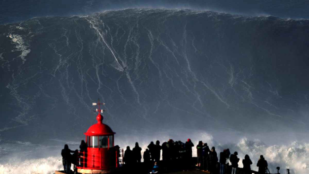 Surfer Sebastian Steudtner drops in on a large wave at Nazare, Portugal.