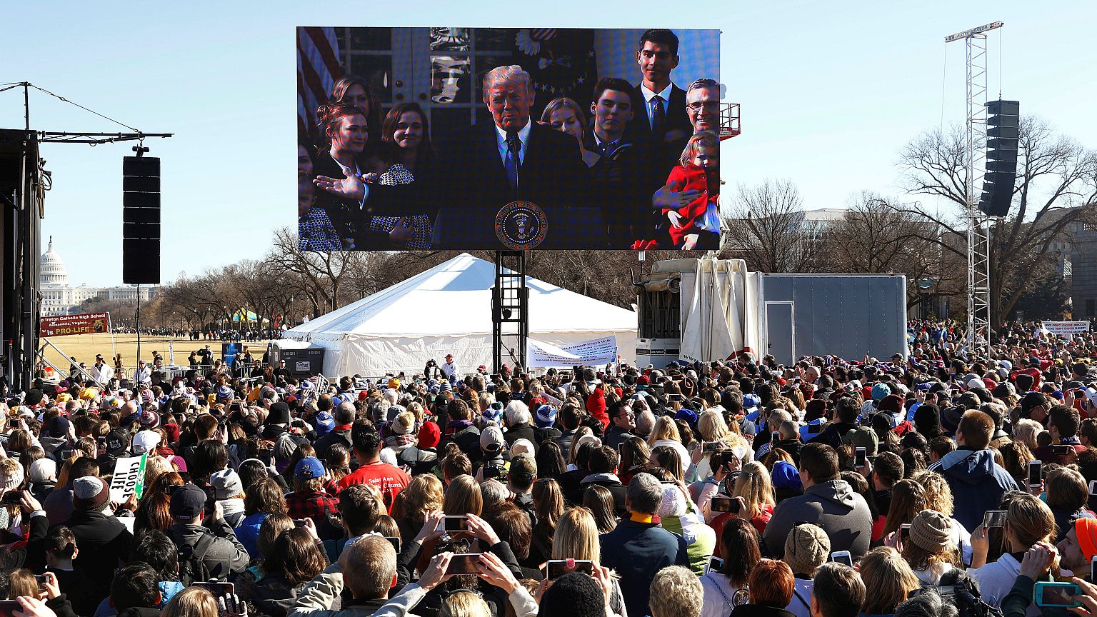 Americans on the march as Trump marks first anniversary in office