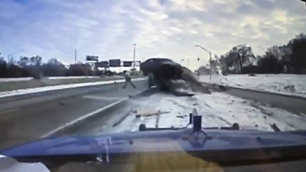 A breakdown truck driver has a lucky escape on a US highway. A breakdown truck driver has a lucky escape on a US highway.