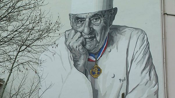Paul Bocuse looks down fondly on Lyon from mural outside Les Halles Paul Bocuse looks down fondly on Lyon from mural outside Les Halles