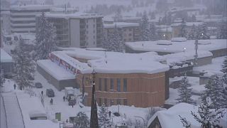 World Economic Forum in Davos battles snow... and awaits Trump