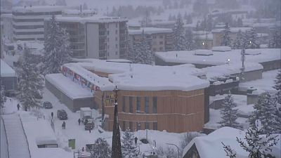 World Economic Forum in Davos battles snow... and awaits Trump