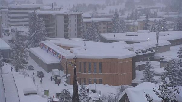 World Economic Forum in Davos battles snow... and awaits Trump World Economic Forum in Davos battles snow... and awaits Trump