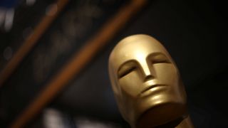 An Oscar statue is seen outside the Dolby Theatre as preparations continue