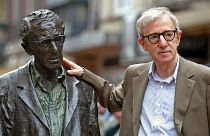 U.S. director Woody Allen poses with a statue of himself in Oviedo