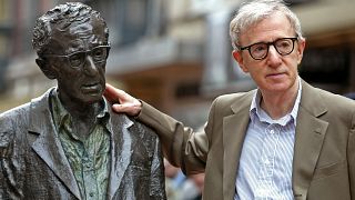 U.S. director Woody Allen poses with a statue of himself in Oviedo