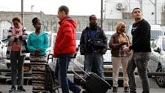 People wait at a bus station in south in Tel Aviv