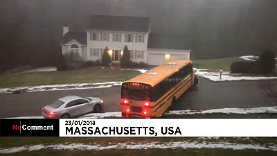 Eyewitness films school bus skidding down an icy hill in Massachusetts