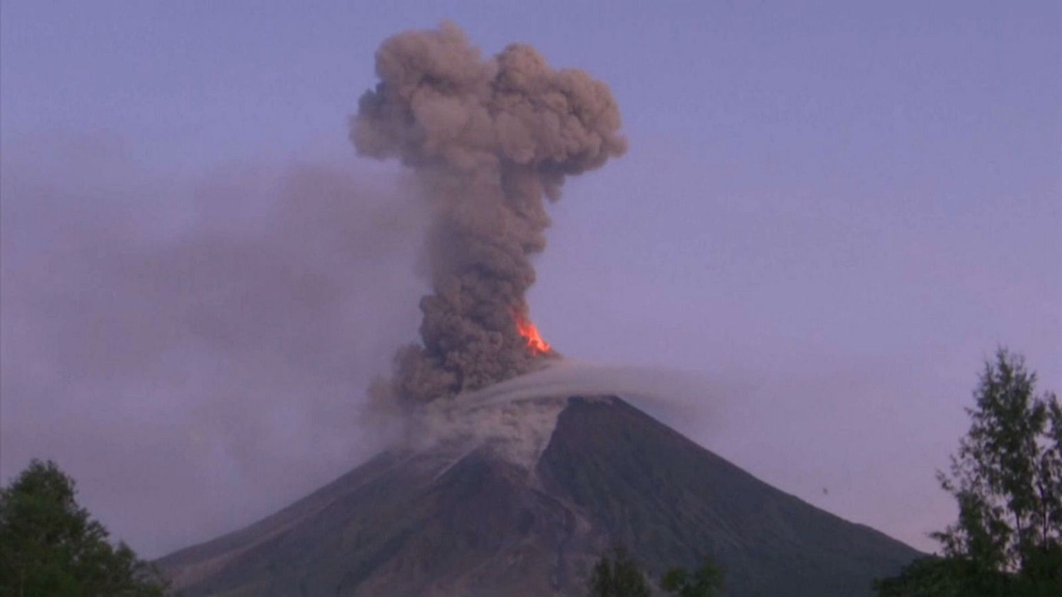 Watch: erupting volcano spews lava and ash into the sky