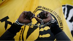 A migrant living in Greece protests reports of migrant slavery in Libya