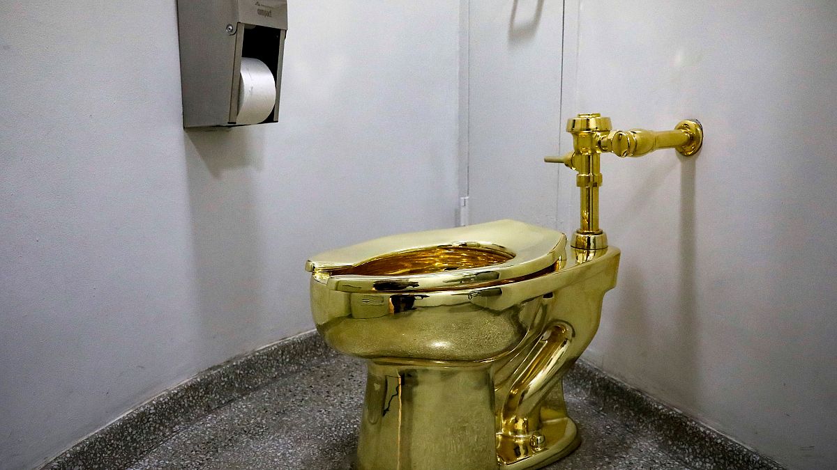 Maurizio Cattelan’s “America,” a fully functional solid gold toilet is seen
