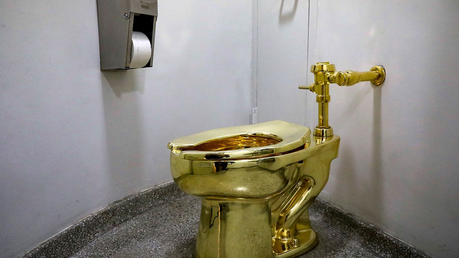 Maurizio Cattelan’s “America,” a fully functional solid gold toilet is seen