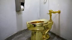 Maurizio Cattelan’s “America,” a fully functional solid gold toilet is seen