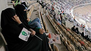 Saudi women watch the soccer match