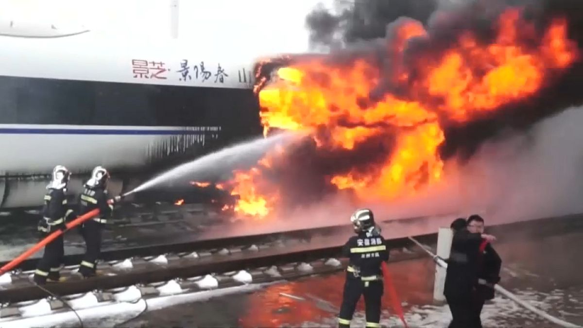Fire crews tackle fire on a high speed train in China's Anhui province