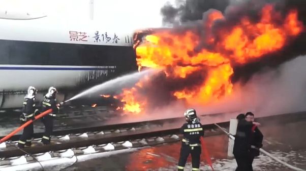 Fire crews tackle fire on a high speed train in China's Anhui province Fire crews tackle fire on a high speed train in China's Anhui province