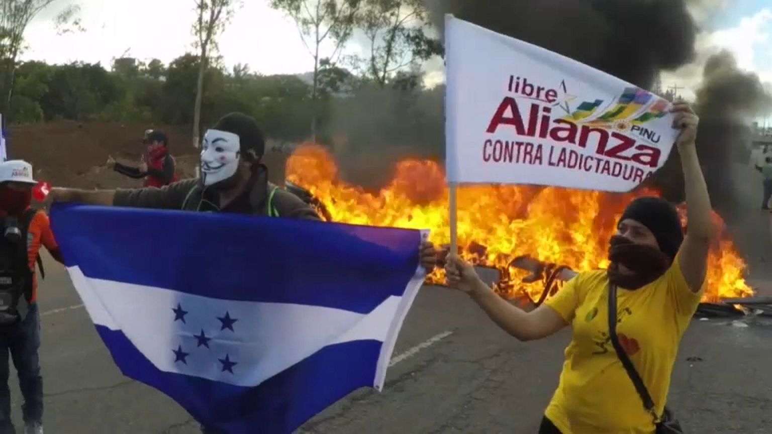 Thousands of Hondurans clashed with police over disputed presidential poll