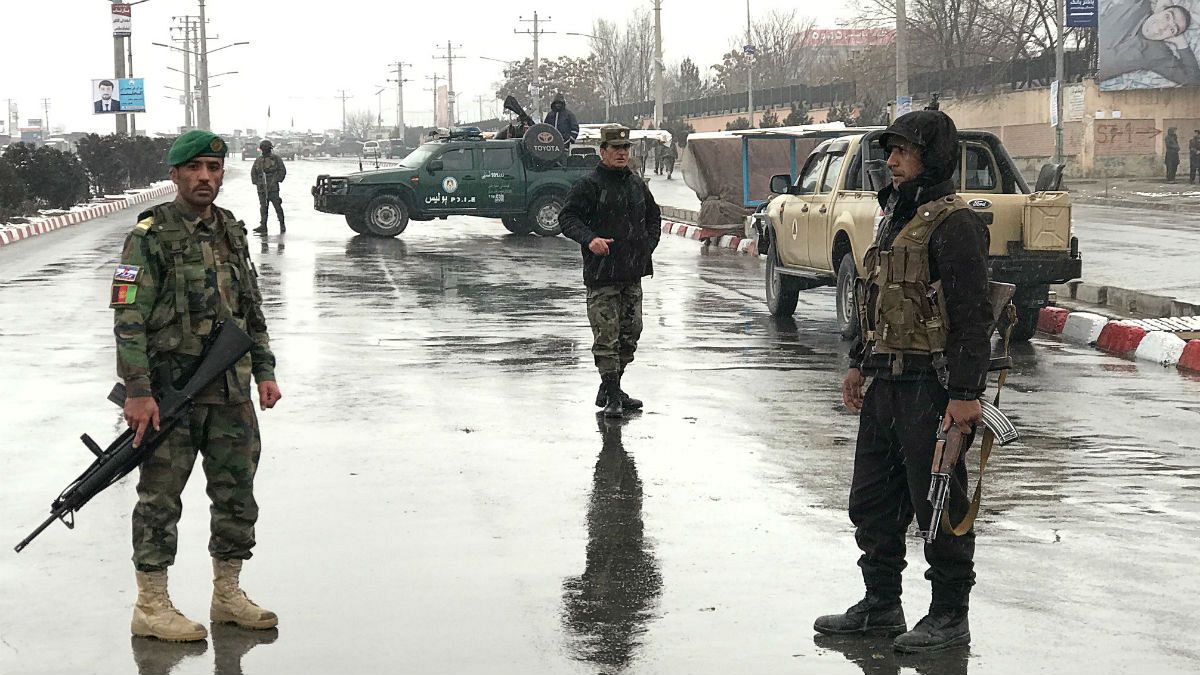 Afghan security forces stand near the Marshal Fahim military academy
