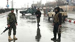 Afghan security forces stand near the Marshal Fahim military academy