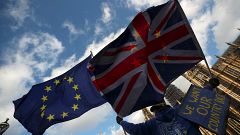 EU and UK flags in front of the House of Parliament in London