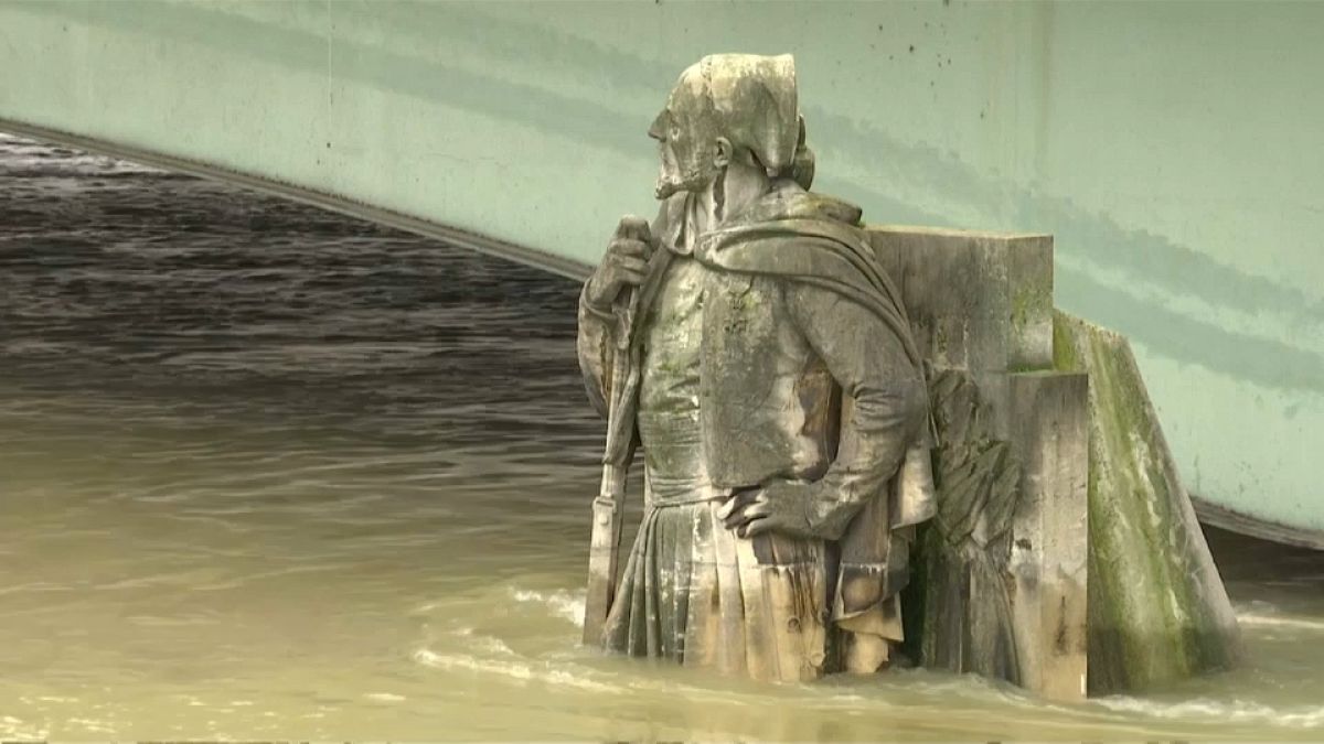 Partially submerged statue in Paris' swollen Seine river