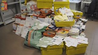 Italian police arrest postman after finding hundreds of undelivered mail at his home