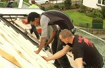 A refugee from Eritrea is trained in roofing in Germany
