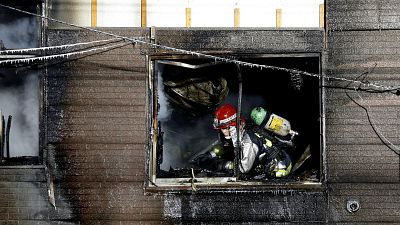A firefighter inspects damage at a senior citizens facility in Sapporo