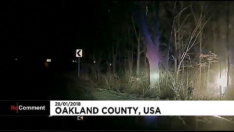 Man rescued from burning car by police in the US