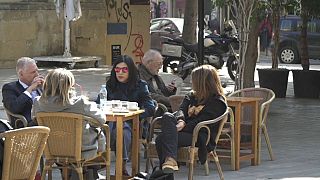 Young Cypriots relax in a cafe in Nicosia