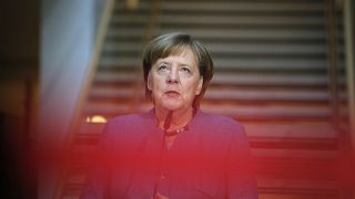 German Chancellor Angela Merkel arrives for coaltion talks at the SPD HQ