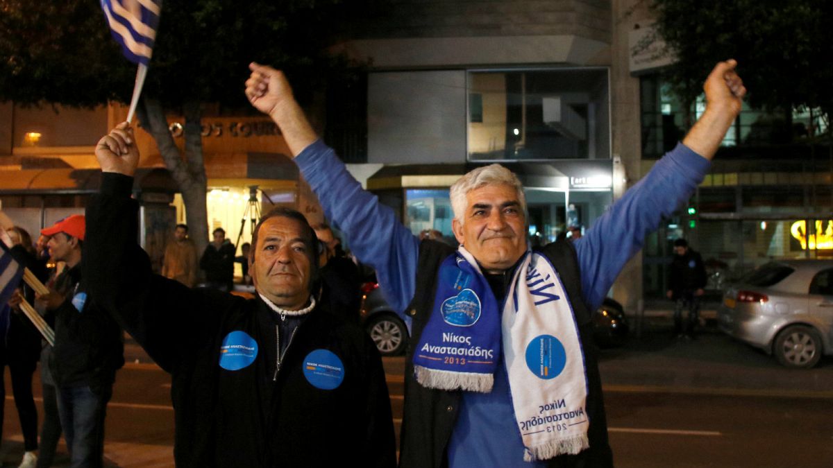 Supporters of incumbent president Nicos Anastasiades celebrate
