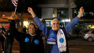 Supporters of incumbent president Nicos Anastasiades celebrate