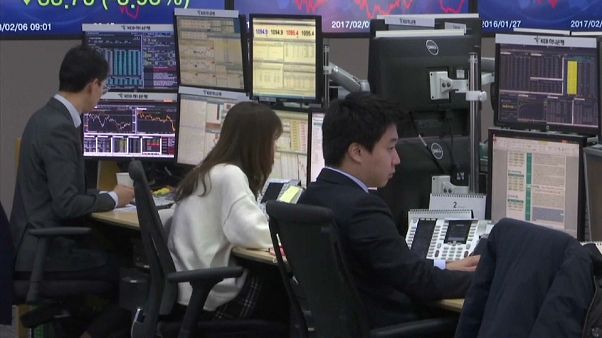 Traders watch stocks slide after shares dropped on Wall Street Traders watch stocks slide after shares dropped on Wall Street