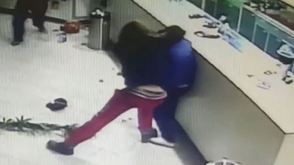 Watch: Sushi restaurant staff fight back during armed heist Watch: Sushi restaurant staff fight back during armed heist