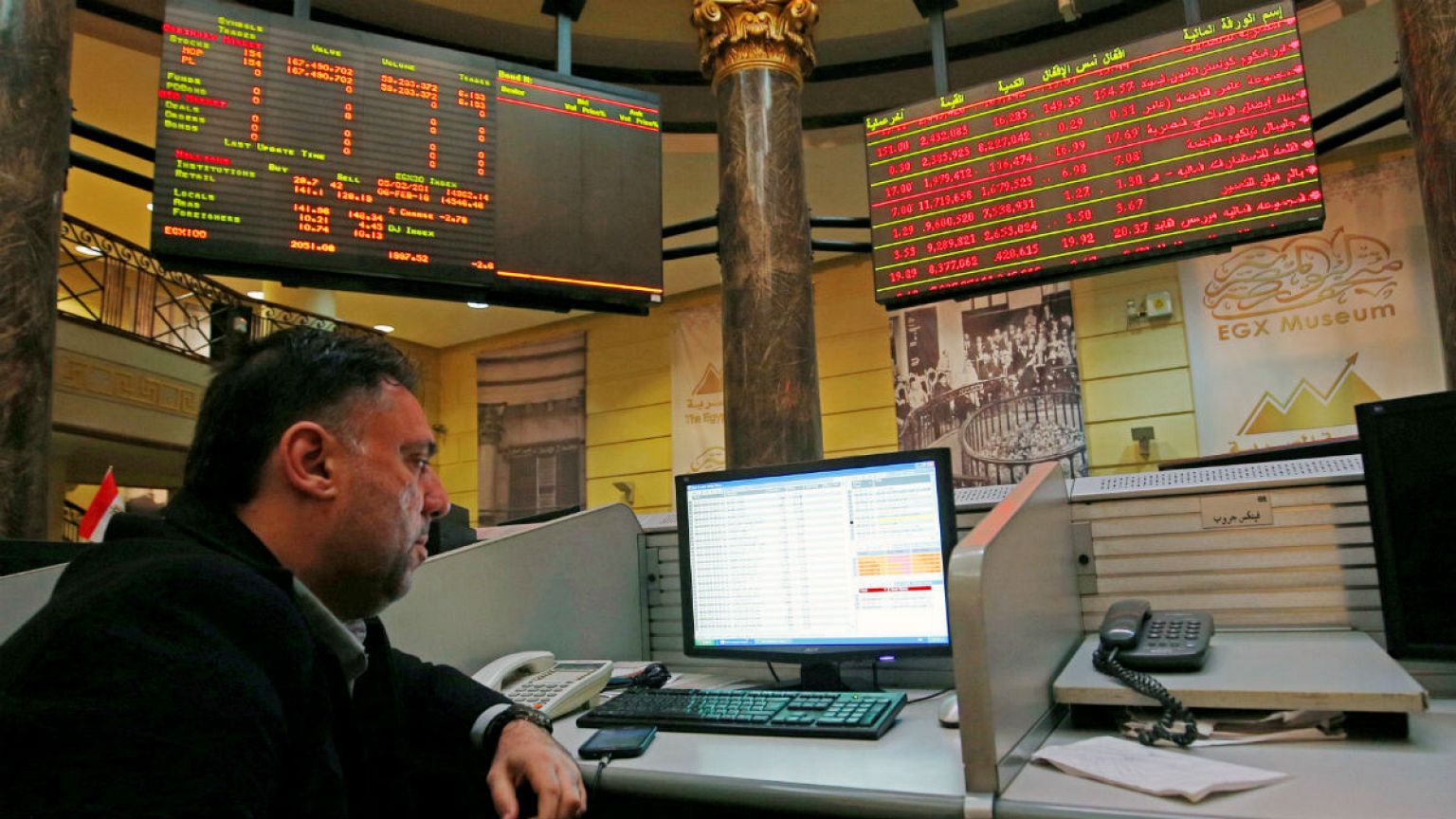 A trader works at the Egyptian stock market in Cairo