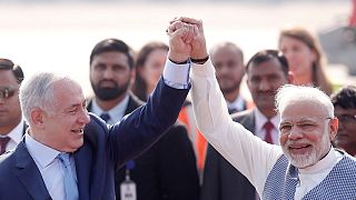 Israeli Netanyahu and hisIndian Narendra Modi raise their arms New Delhi