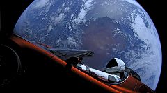 A car floats through space after it was carried by SpaceX's Falcon Heavy