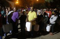 People queue to collect water in Cape Town, South Africa