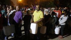 People queue to collect water in Cape Town, South Africa