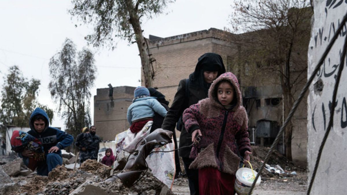  UNICEF/Alessio Romenzi أسرة عراقية نازحة