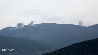 Smoke rises on the mountains as seen from Northern Afrin countryside, Syria