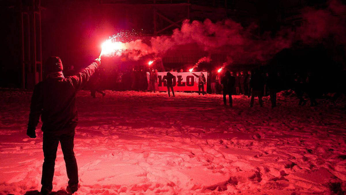 Supporters of far right groups hold flares in Poland