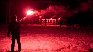 Supporters of far right groups hold flares in Poland