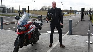 Prince William showed how to ride a Triumph motorbike and drive an Aston Martin