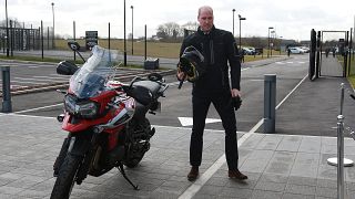 Prince William showed how to ride a Triumph motorbike and drive an Aston Martin 