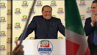 Despite a ban from public office former Italian Prime Minister Silvio Berlusconi addresses supporters as the national election campaign intensifies