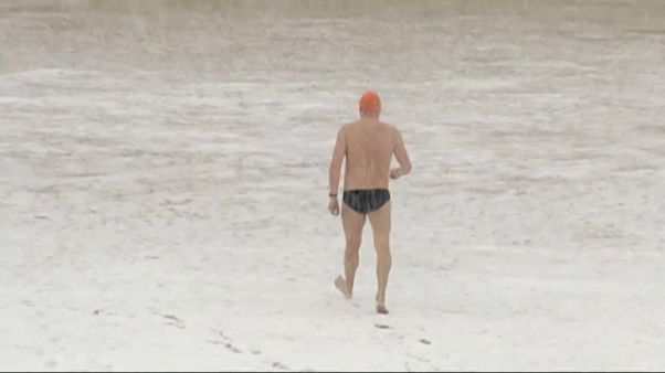 Brave swimmer in San Sebastian, Spain goes for a dip Brave swimmer in San Sebastian, Spain goes for a dip