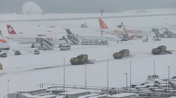 Snow ploughs clear snow from Geneva airport Snow ploughs clear snow from Geneva airport